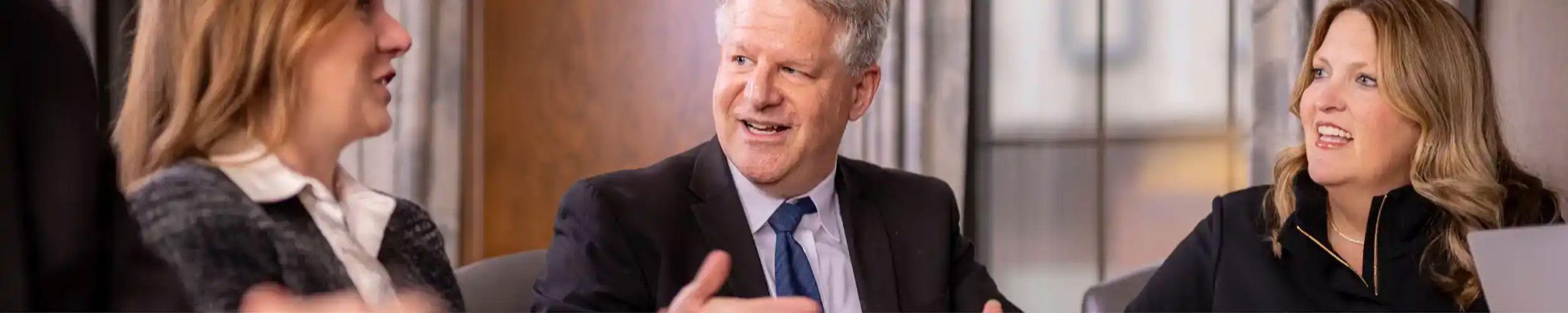 Three lawyers having a conversation in the office