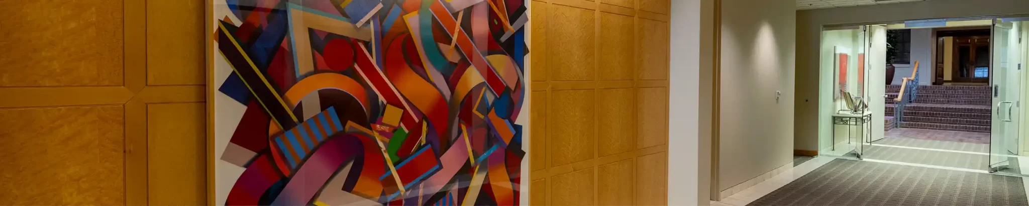 Office corridor with large abstract painting on the wall
